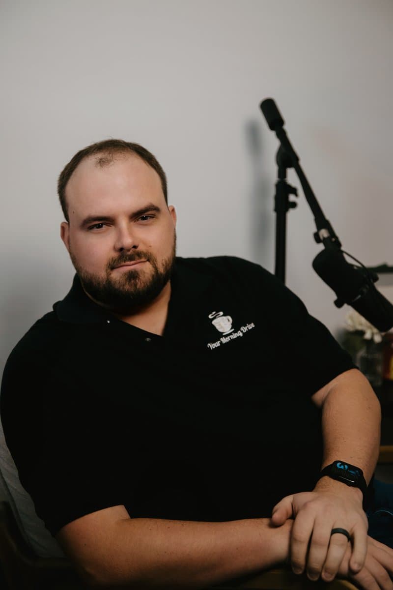 Logan Lewis recording a podcast episode